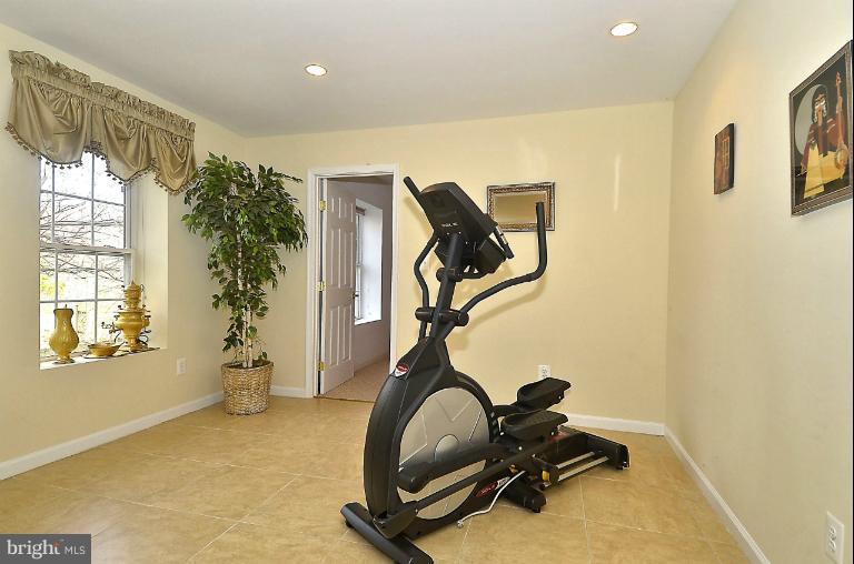 505 Great Falls Road Rockville, MD 20850 - Photo 3 of 30 a room with gym equipment and windows