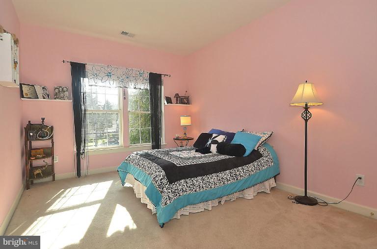 505 Great Falls Road Rockville, MD 20850 - Photo 22 of 30 a bedroom with a bed and a window