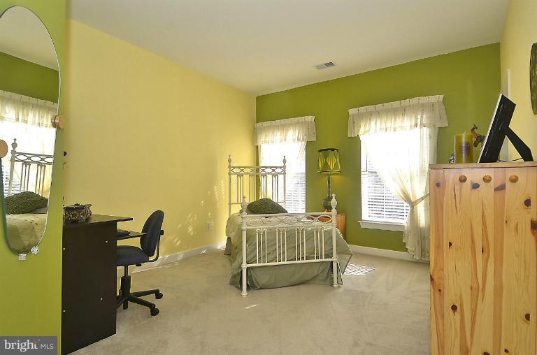 505 Great Falls Road Rockville, MD 20850 - Photo 7 of 30 a bedroom with a bed and a desk