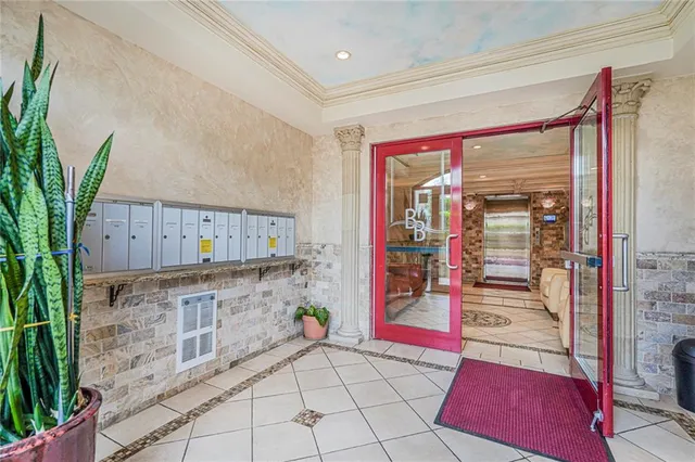a spacious bathroom with a granite countertop shower a sink and a mirror