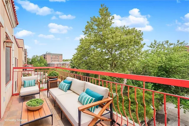 a view of balcony with furniture