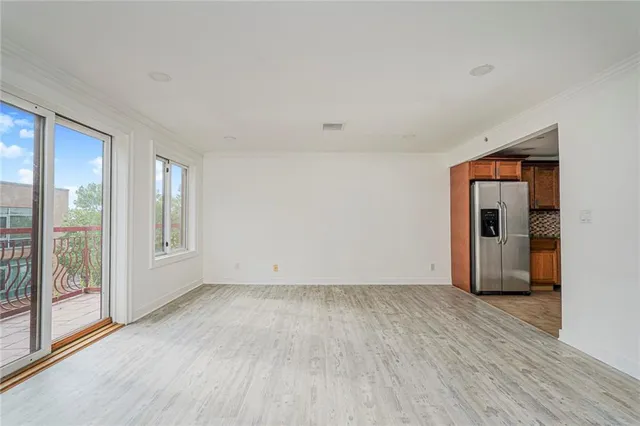 a view of an empty room with glass door