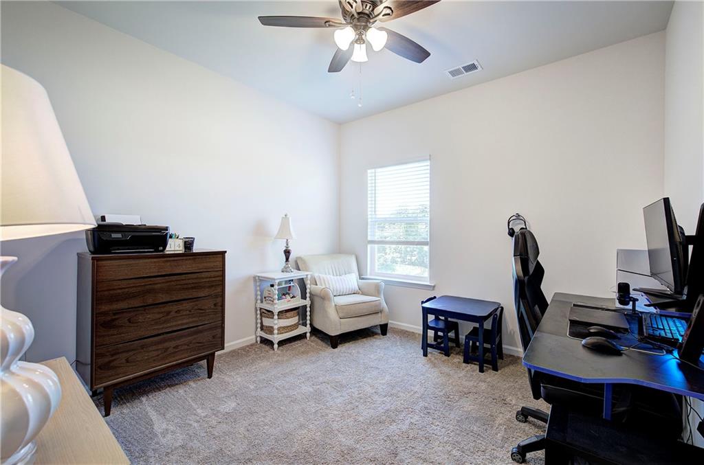 402 Perth Drive Cartersville, GA 30121 - Photo 17 of 31 a view of a workspace with furniture and a window