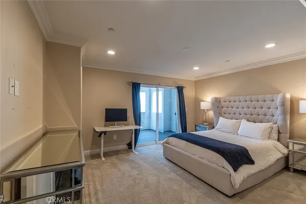 a bedroom with a bed and tv