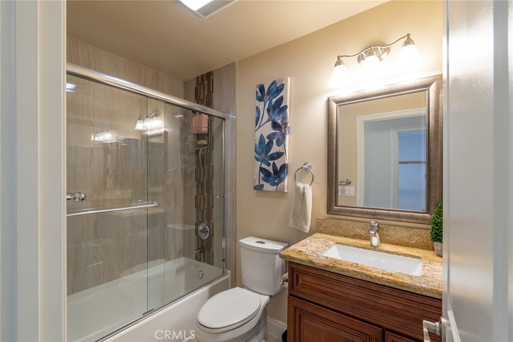 7019 Passons Boulevard Pico Rivera, CA 90660 - Photo 22 of 27 a bathroom with a granite countertop sink toilet and shower