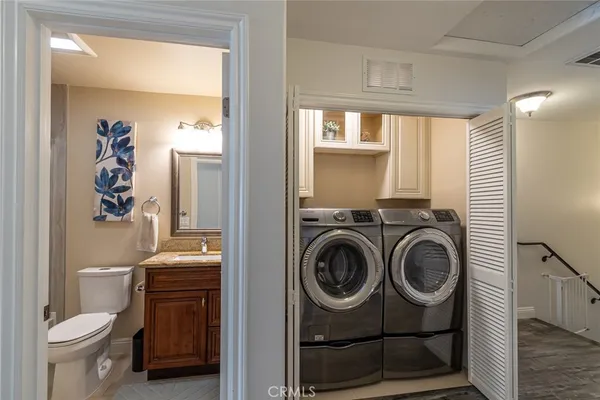 a view of bathroom with a toilet and a sink