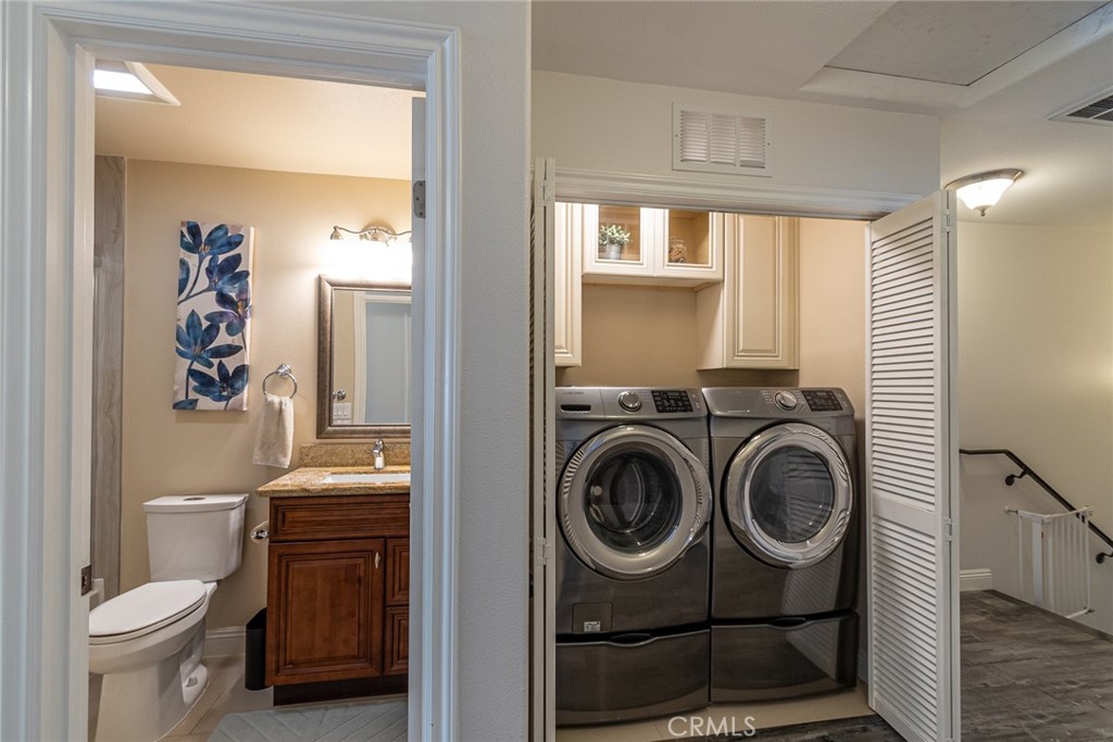 7019 Passons Boulevard Pico Rivera, CA 90660 - Photo 23 of 27 a utility room with dryer washer and a view of bathroom