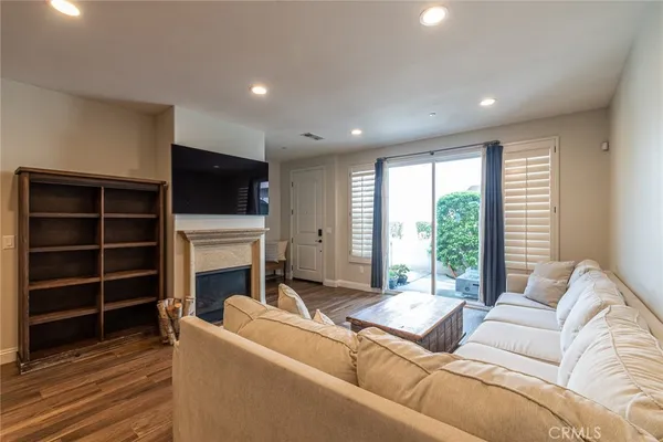 a living room with furniture window and a fireplace