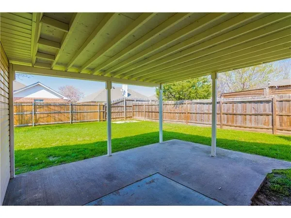 a view of a backyard with porch