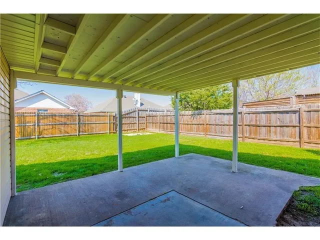 a view of a backyard with porch