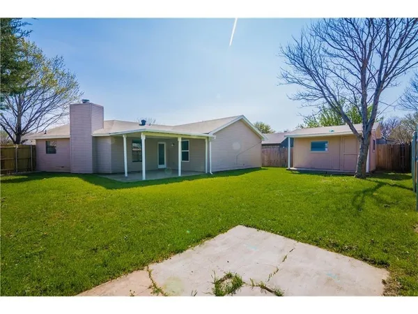 a house view with a garden space