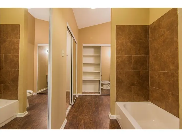 a bathroom with a bathtub and shower