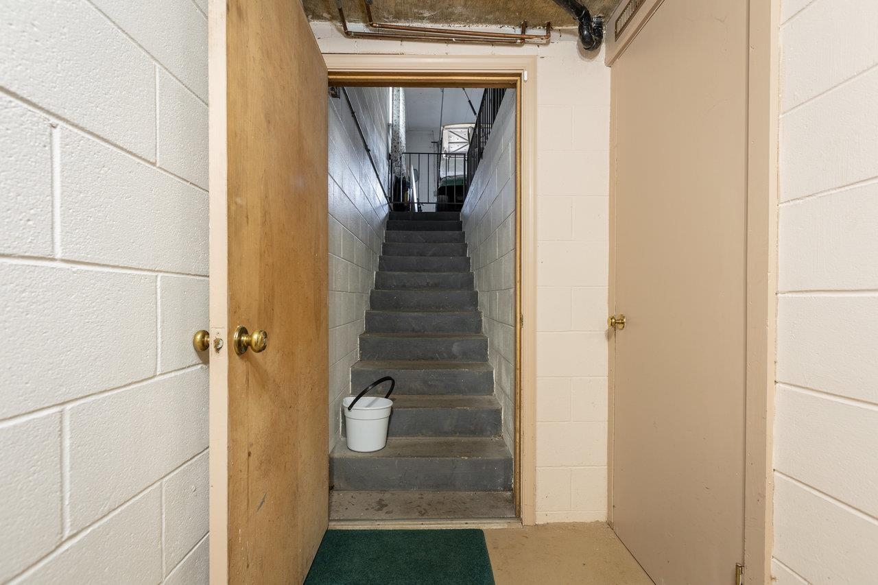 3885 Fulton School Road Dayton, VA 22821 - Photo 41 of 75 a view of a hallway with wooden floor and staircase