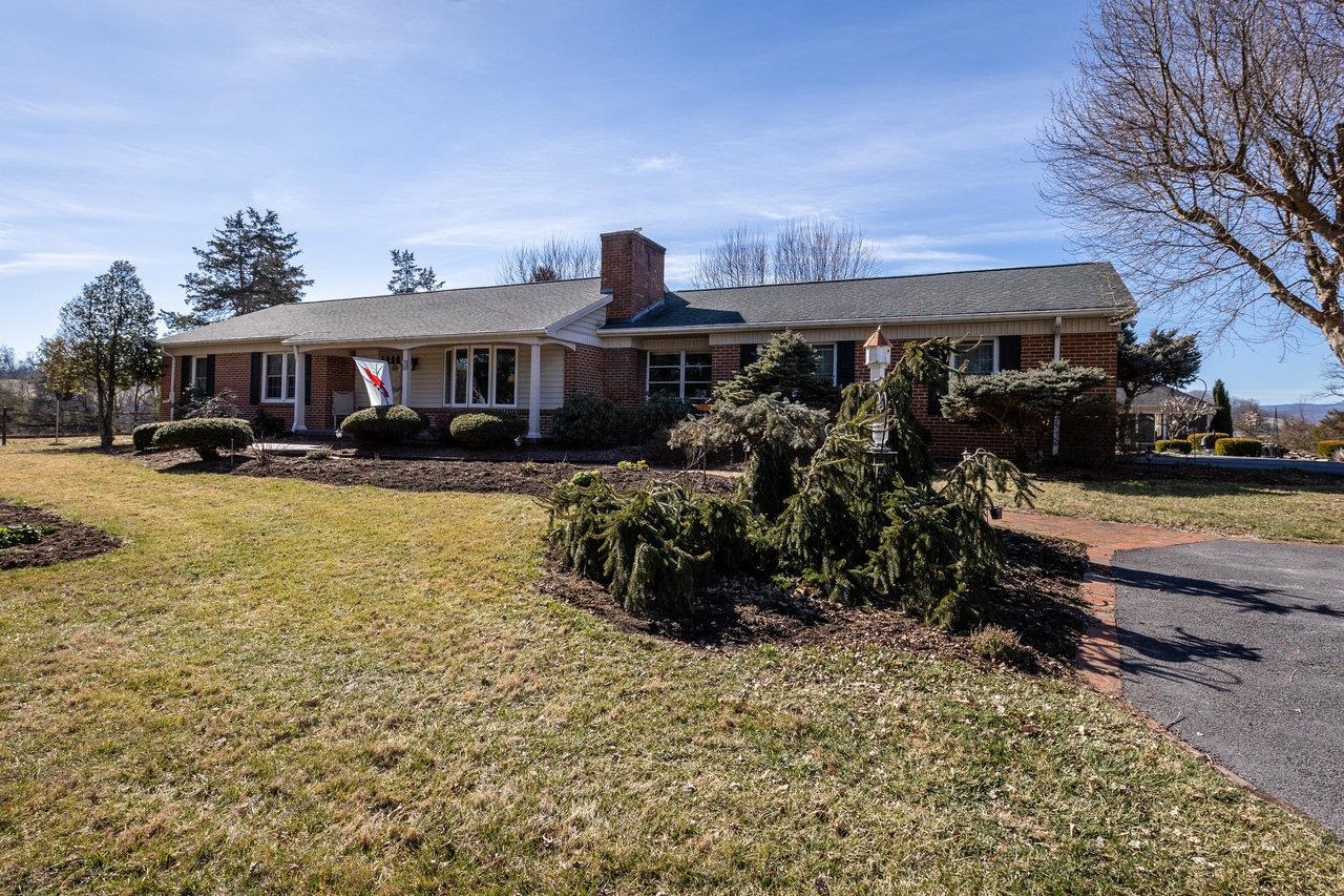 3885 Fulton School Road Dayton, VA 22821 - Photo 45 of 75 a front view of a house with a yard outdoor seating and covered with trees