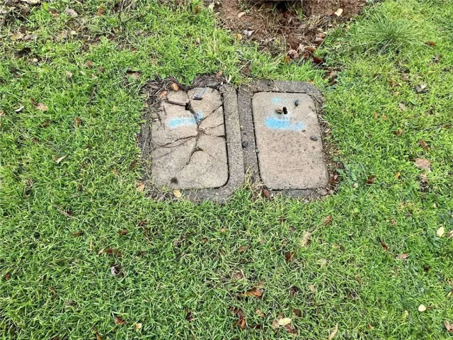 an aerial view of a house with a yard and sitting area