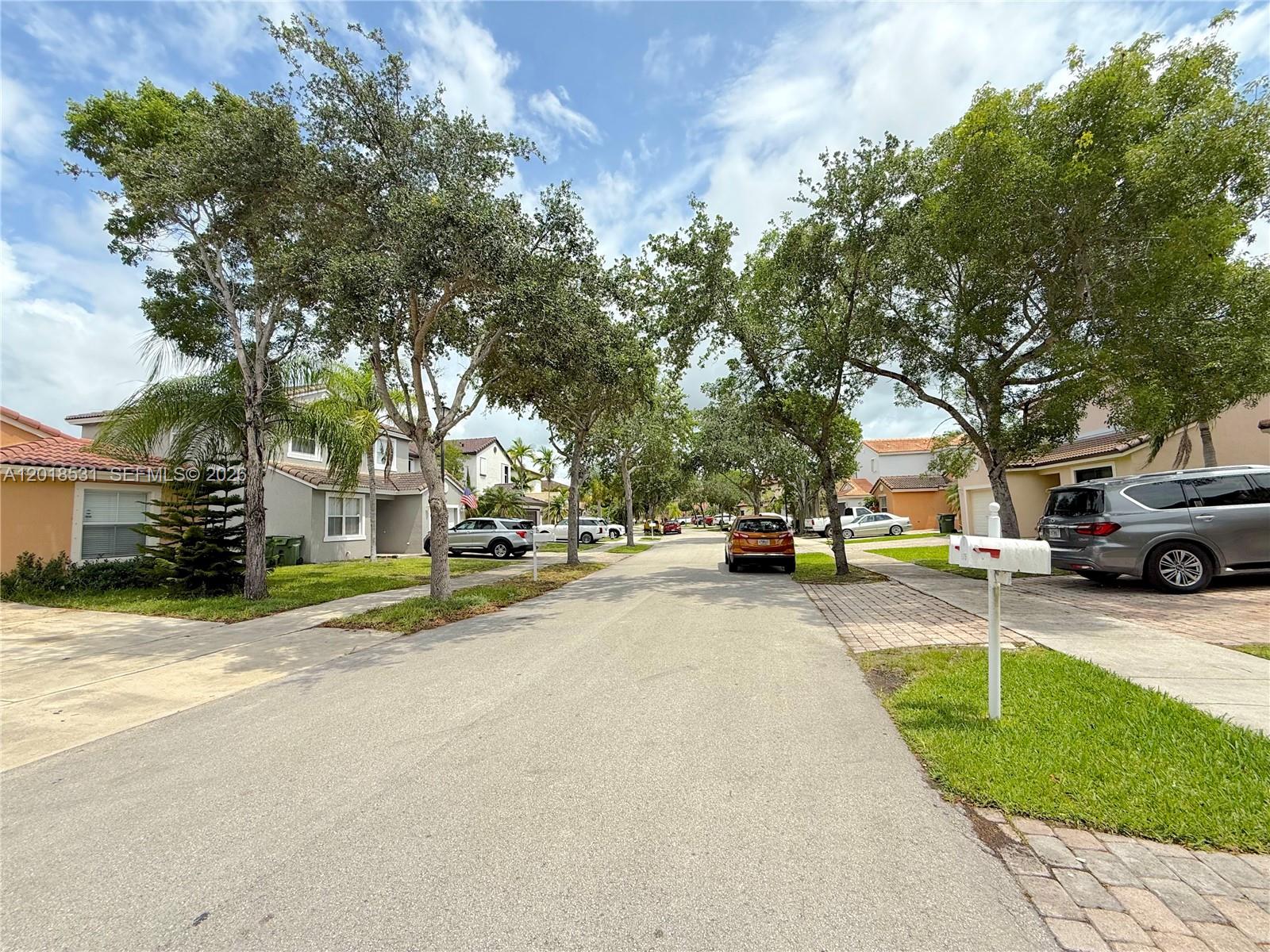1575 Southeast 20th Road Homestead, FL 33035 - Photo 18 of 19 a view of a street with houses