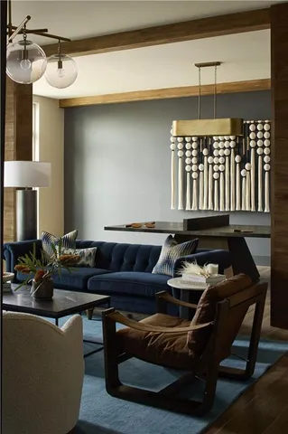 a living room with furniture a ceiling fan and a window