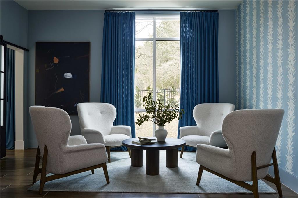 1809 Appaloosa Lane Northeast, Unit 1C Buford, GA 30519 - Photo 12 of 15 a living room with furniture and wooden floor