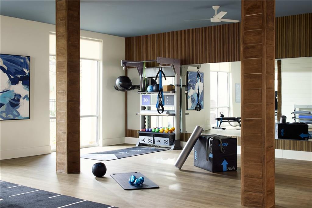 1809 Appaloosa Lane Northeast, Unit 1C Buford, GA 30519 - Photo 14 of 15 a view of living room with furniture and floor to ceiling window