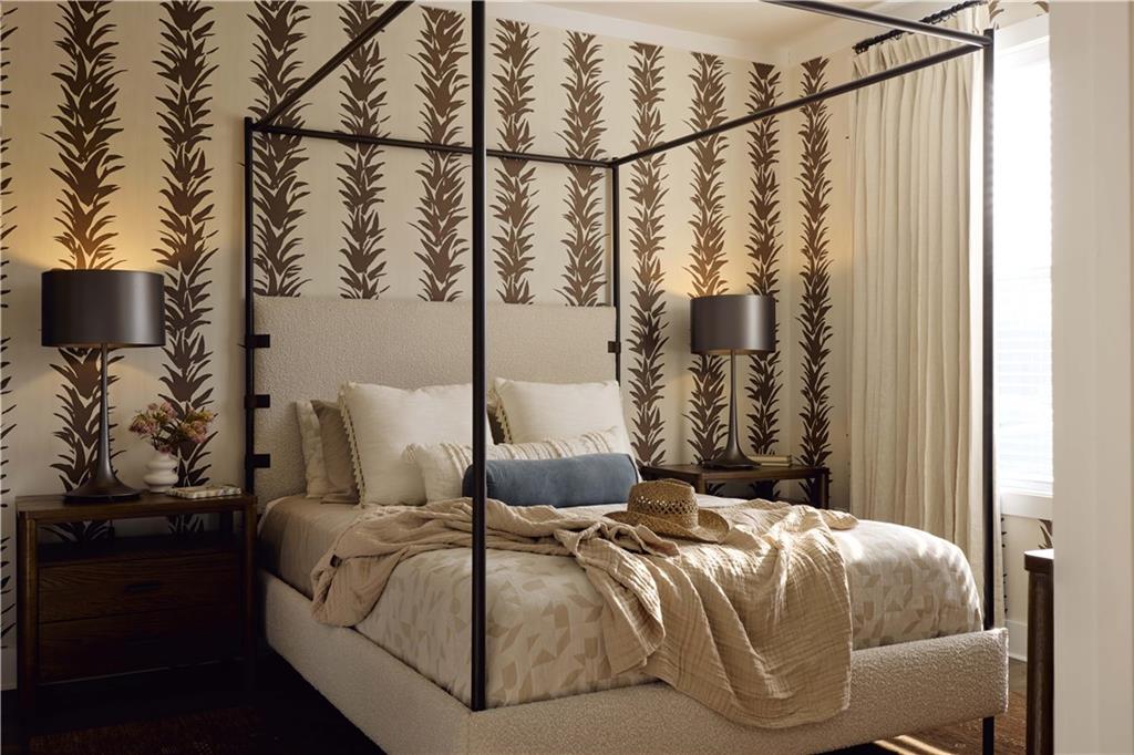 1809 Appaloosa Lane Northeast, Unit 1C Buford, GA 30519 - Photo 6 of 15 a bedroom with a bed and lamp on the dresser