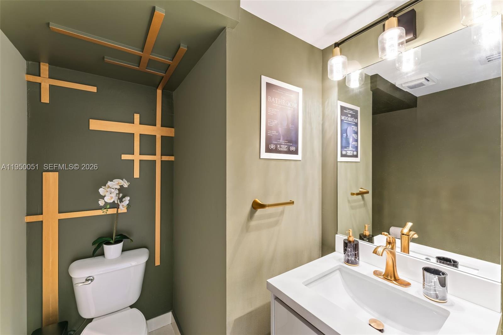 7226 Northwest 103rd Path Doral, FL 33178 - Photo 17 of 38 a bathroom with a sink mirror vanity and toilet