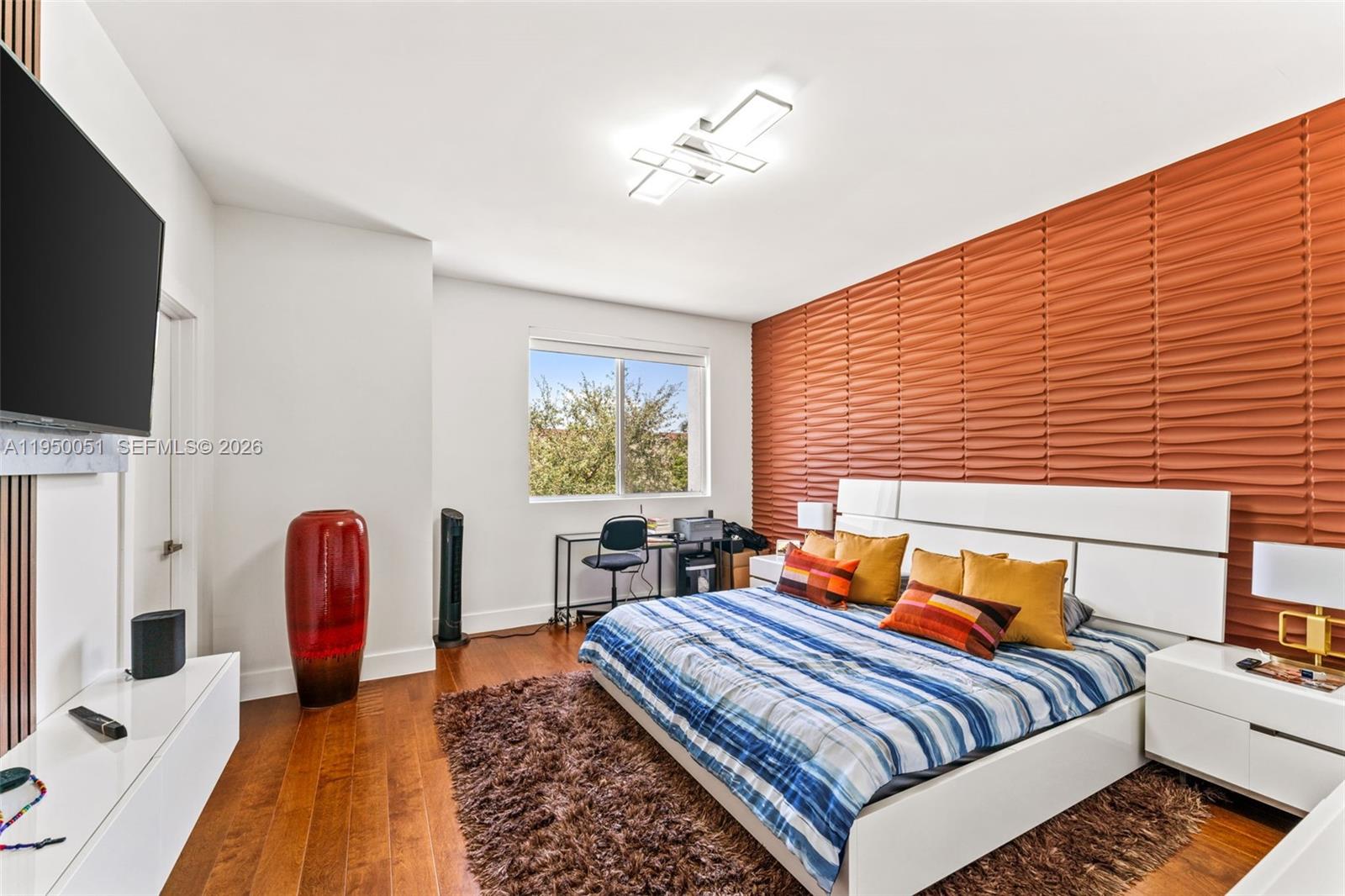 7226 Northwest 103rd Path Doral, FL 33178 - Photo 20 of 38 a bedroom with furniture and a flat screen tv