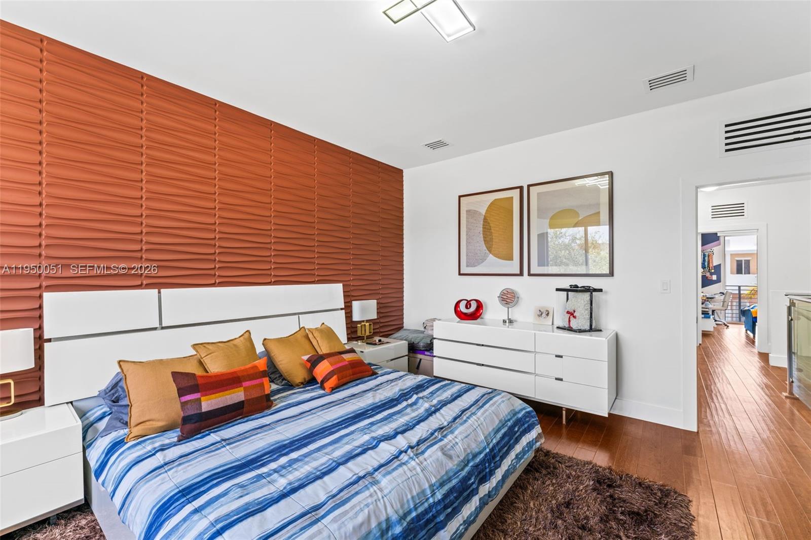 7226 Northwest 103rd Path Doral, FL 33178 - Photo 21 of 38 a bedroom with furniture and a wooden floor