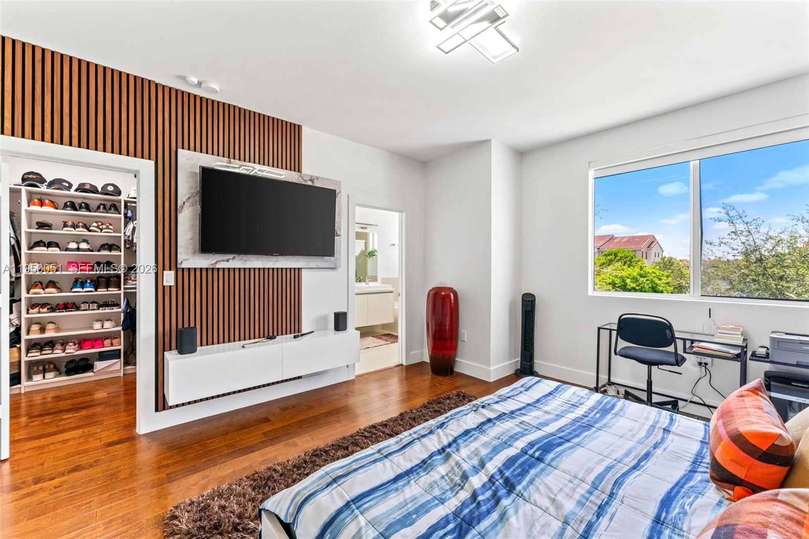 7226 Northwest 103rd Path Doral, FL 33178 - Photo 22 of 38 a bedroom with furniture and a flat screen tv