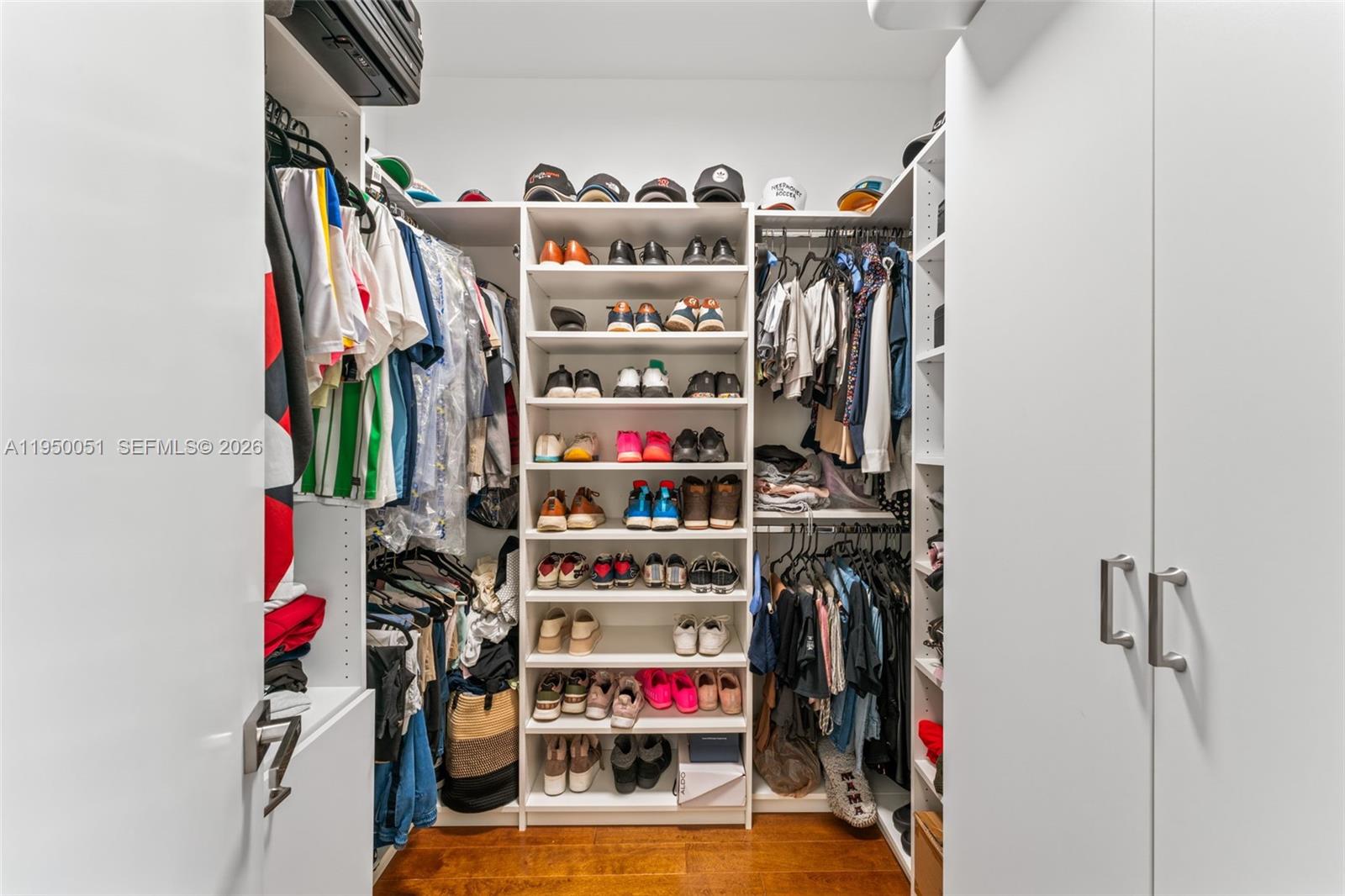 7226 Northwest 103rd Path Doral, FL 33178 - Photo 23 of 38 a view of walk in closet with clothes and shoes