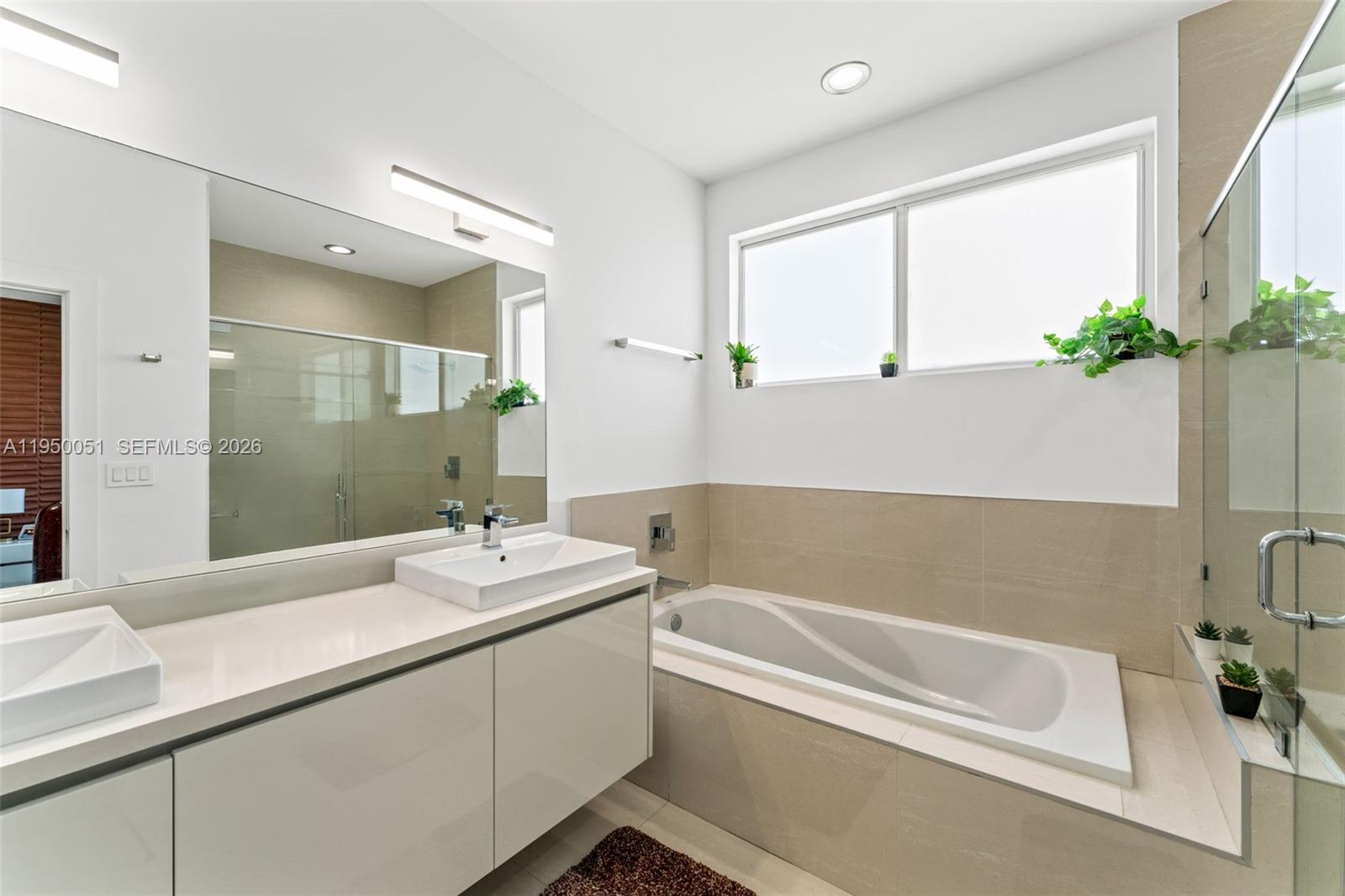7226 Northwest 103rd Path Doral, FL 33178 - Photo 24 of 38 a bathroom with a bathtub and a sink