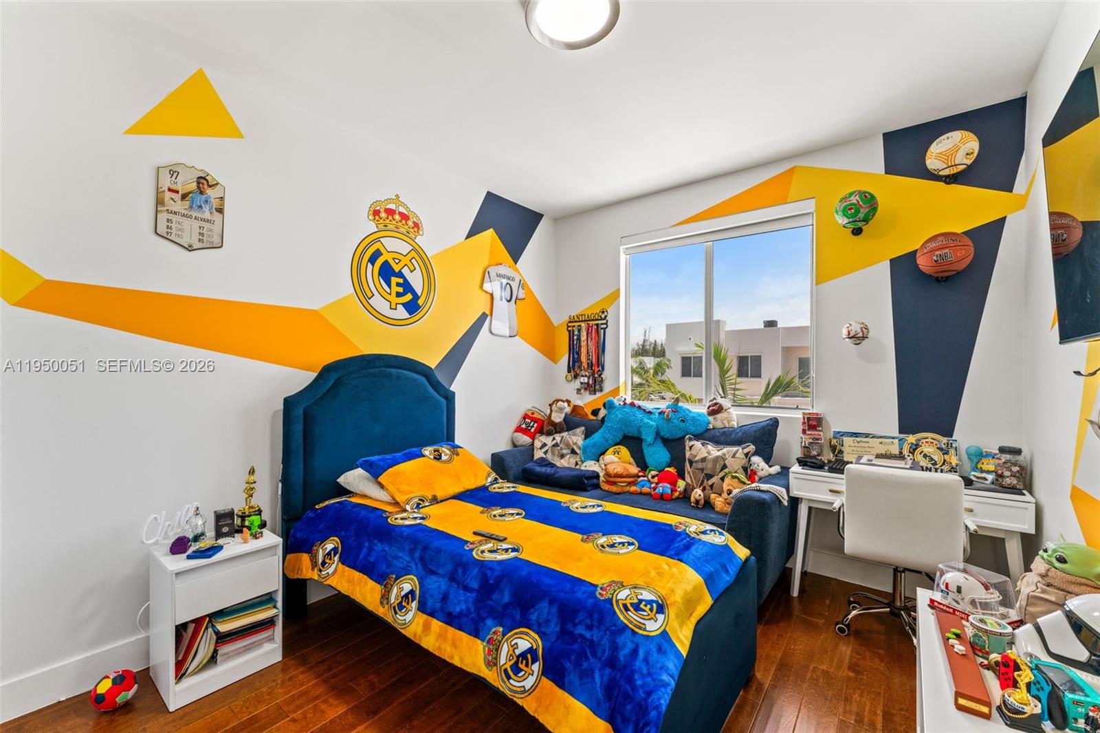 7226 Northwest 103rd Path Doral, FL 33178 - Photo 25 of 38 a bed sitting in a bedroom next to a window