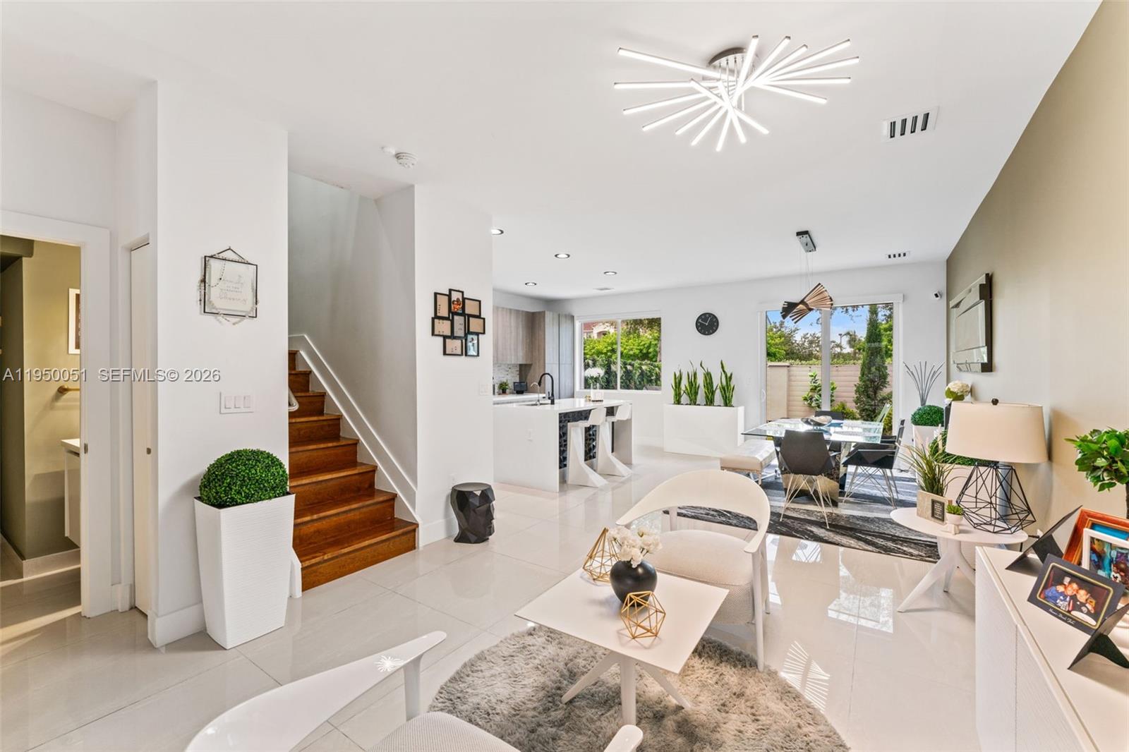 7226 Northwest 103rd Path Doral, FL 33178 - Photo 6 of 38 a living room with furniture and wooden floor