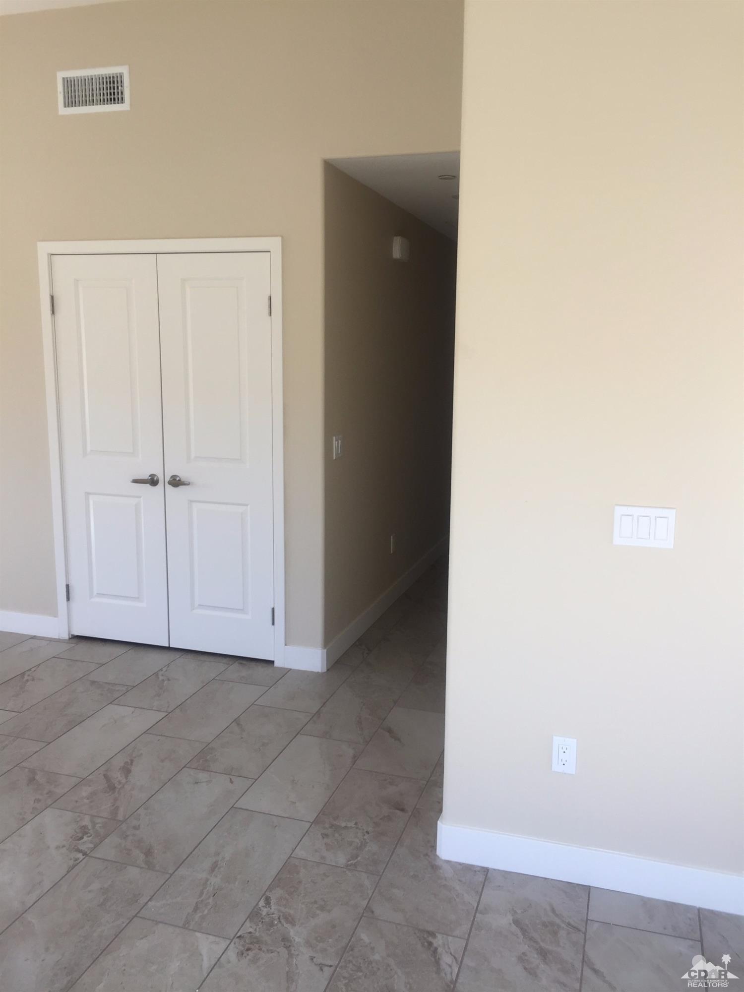 13689 Ocotillo Road Desert Hot Springs, CA 92240 - Photo 5 of 9 a view of an empty room