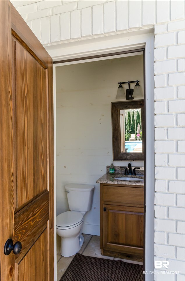 533 Falling Water Boulevard Fairhope, AL 36532 - Photo 42 of 50 Half bath outside for pool and kitchen area