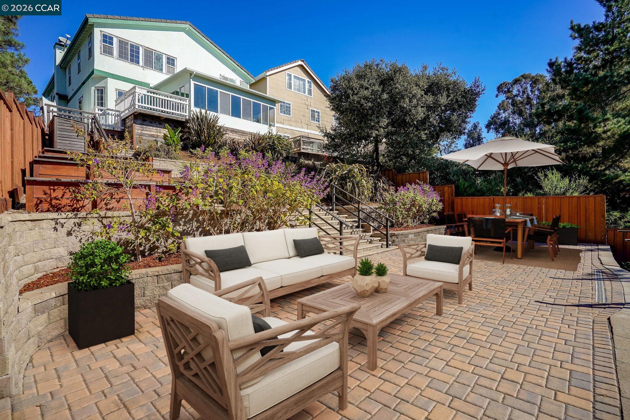 a view of a patio with couches and potted plants