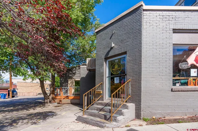a front view of a house with stairs