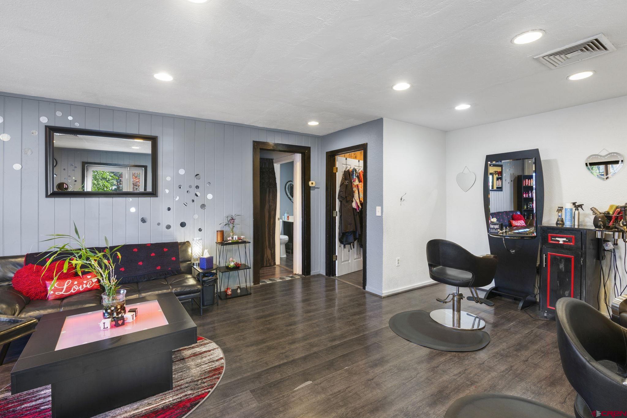 171 East 7th Street Durango, CO 81301 - Photo 12 of 36 a living room with furniture chess board and a wooden floor
