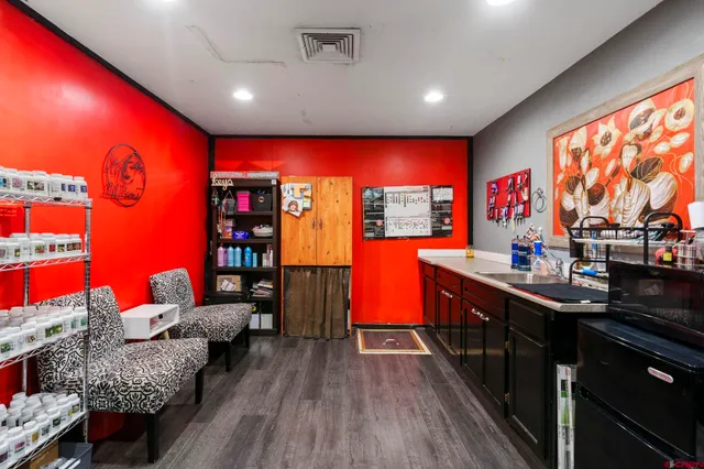 a living room with furniture a rug and a large window
