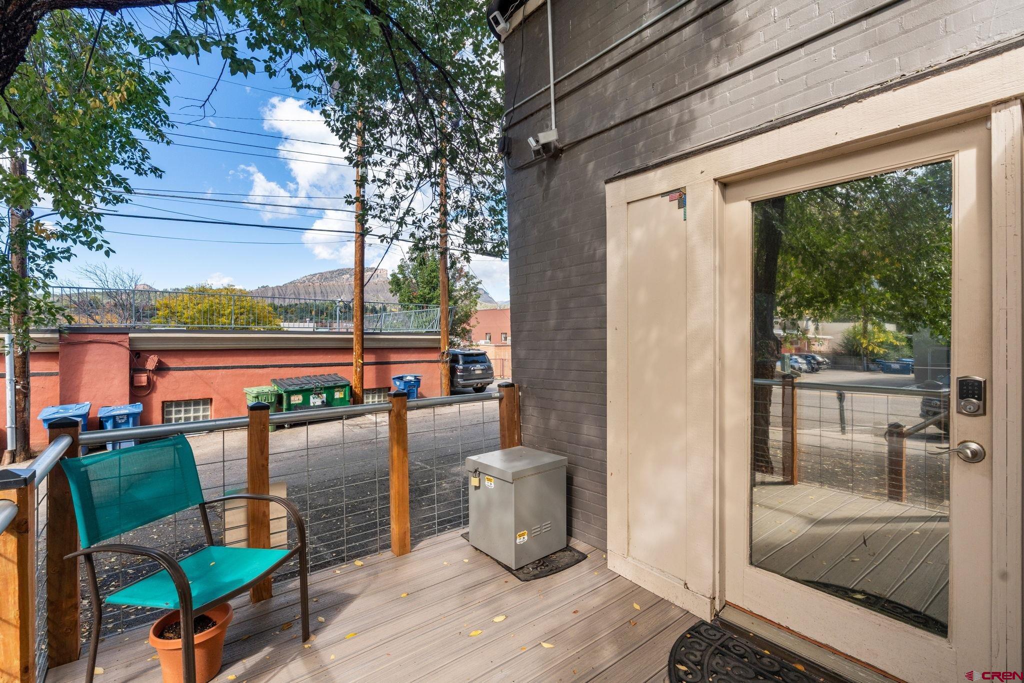 171 East 7th Street Durango, CO 81301 - Photo 2 of 36 a view of a balcony with chairs and wooden floor