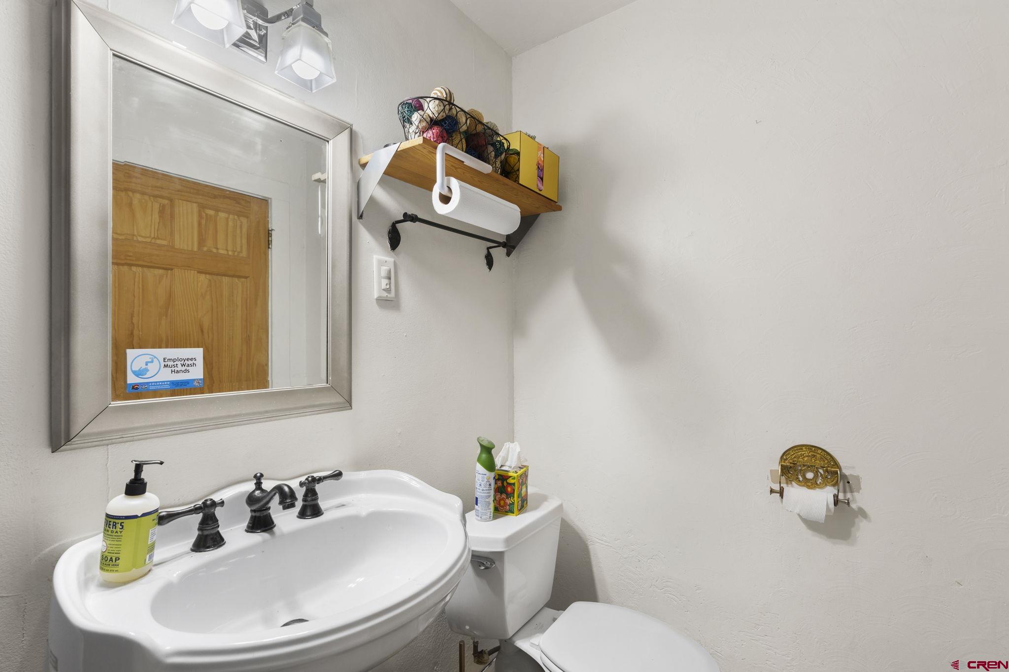 171 East 7th Street Durango, CO 81301 - Photo 30 of 36 a bathroom with a sink mirror and toilet