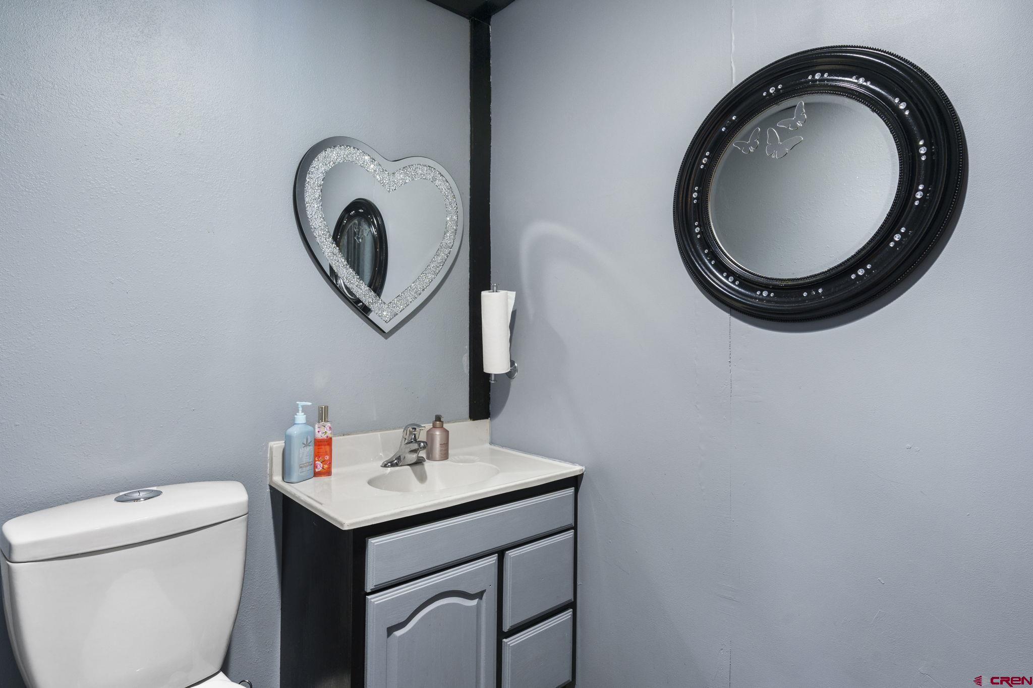 171 East 7th Street Durango, CO 81301 - Photo 31 of 36 a bathroom with a sink and a mirror
