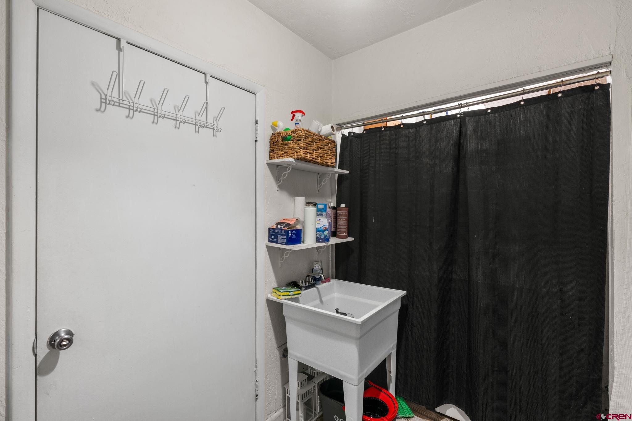 171 East 7th Street Durango, CO 81301 - Photo 33 of 36 a bathroom with a sink and mirror