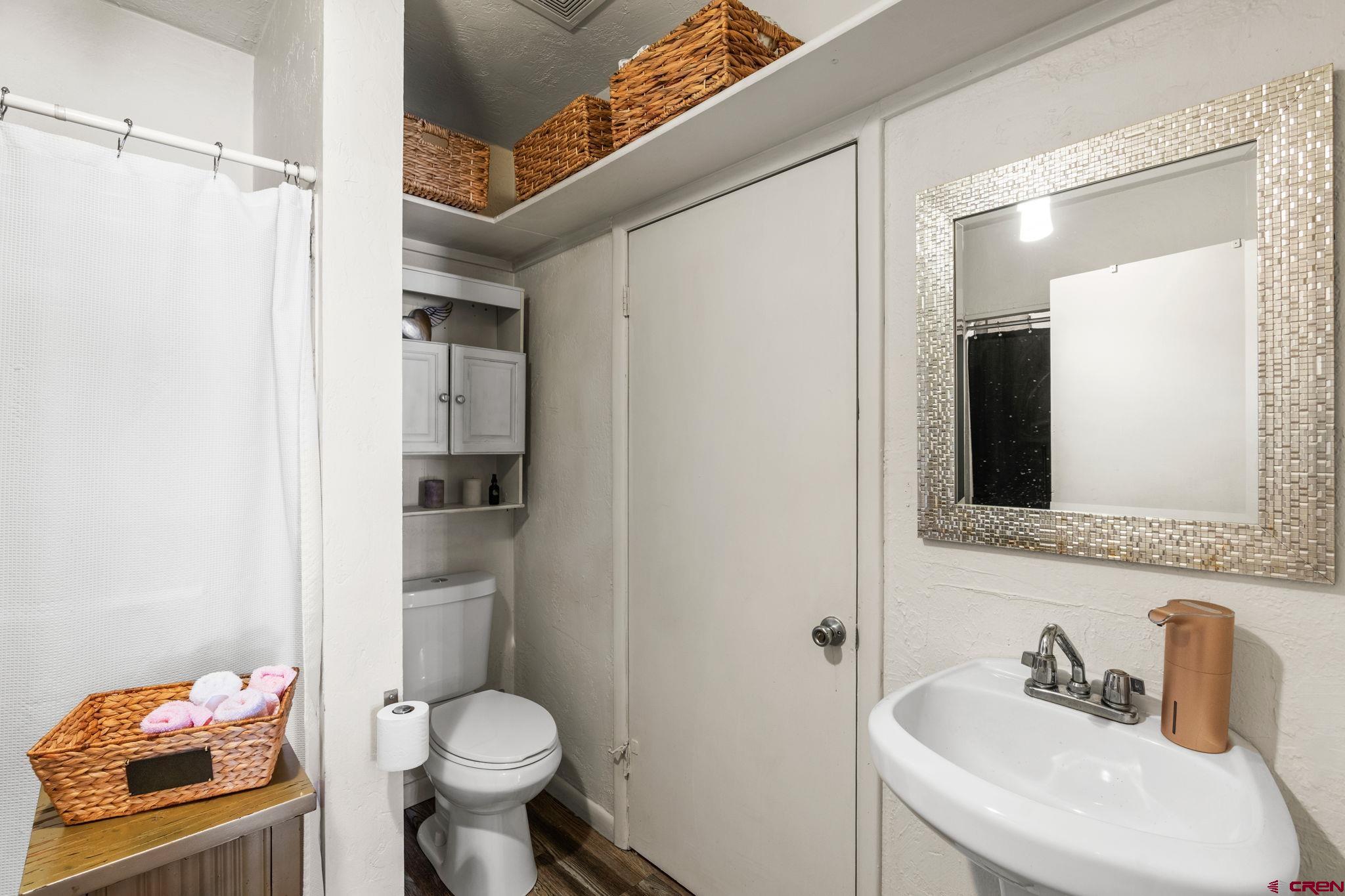 171 East 7th Street Durango, CO 81301 - Photo 34 of 36 a bathroom with a sink toilet and shower