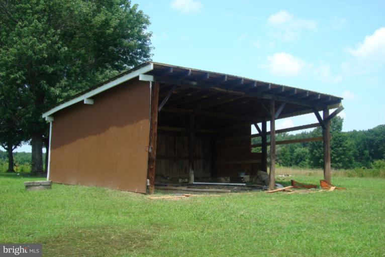 9001 Marye Road Partlow, VA 22534 - Photo 19 of 25 a view of a backyard with large trees
