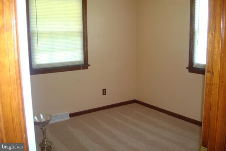 9001 Marye Road Partlow, VA 22534 - Photo 7 of 25 a view of a small space with wooden floor and a window