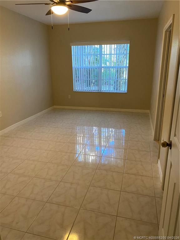 467 Southeast Kitching Circle Stuart, FL 34994 - Photo 8 of 11 a view of an empty room and window