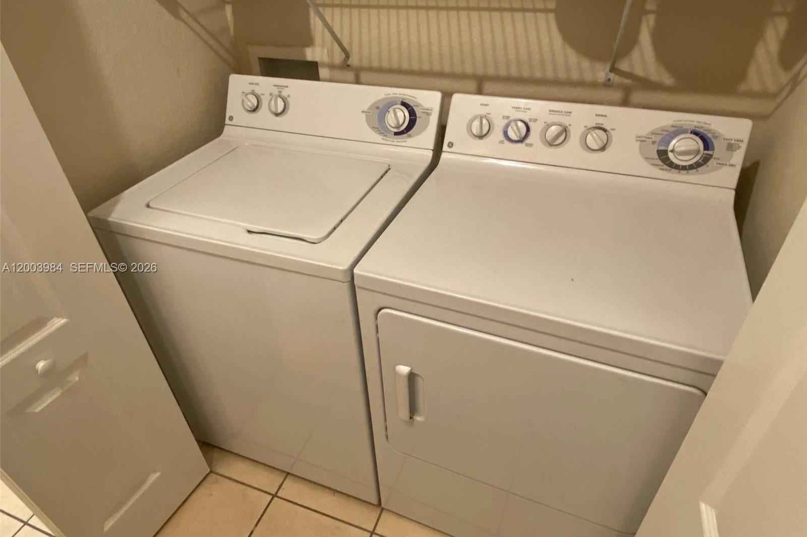 6001 Southwest 70th Street, Unit 342 South Miami, FL 33143 - Photo 15 of 19 a close up view of washer and dryer