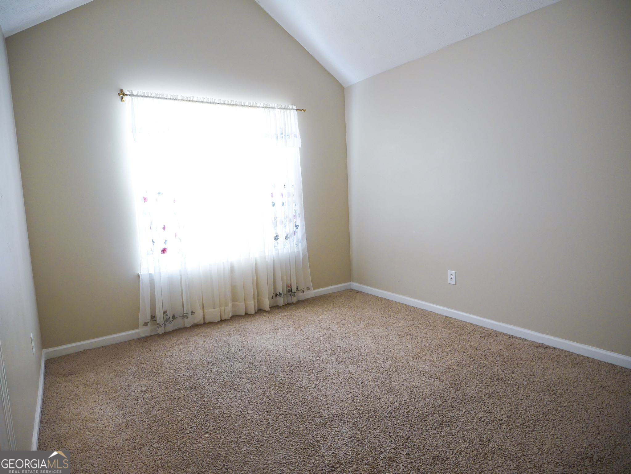 11036 Pebble Ridge Drive Hampton, GA 30228 - Photo 16 of 35 an empty room with a window