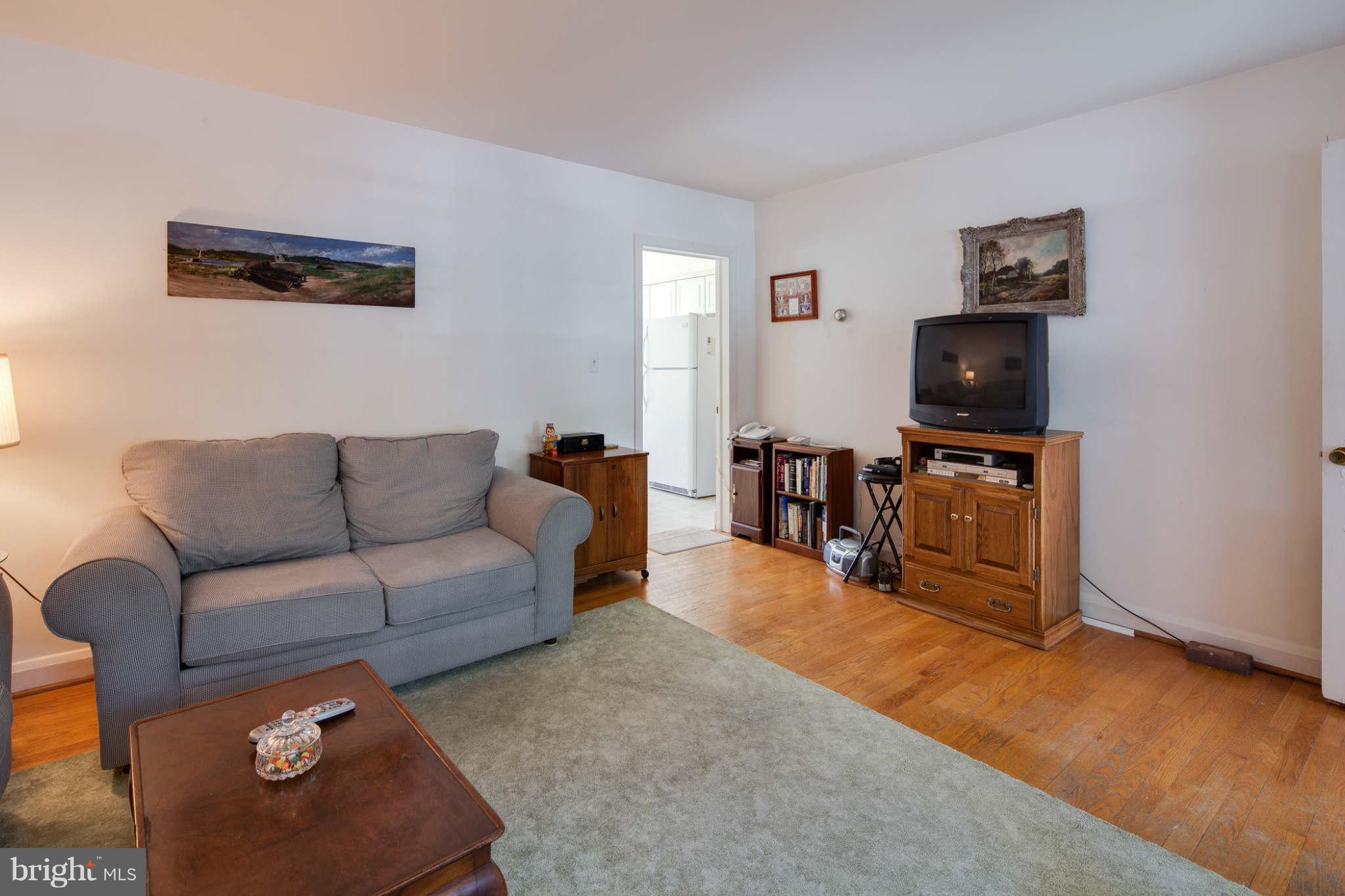 342 Greenlow Road Baltimore, MD 21228 - Photo 11 of 28 a living room with furniture and a flat screen tv