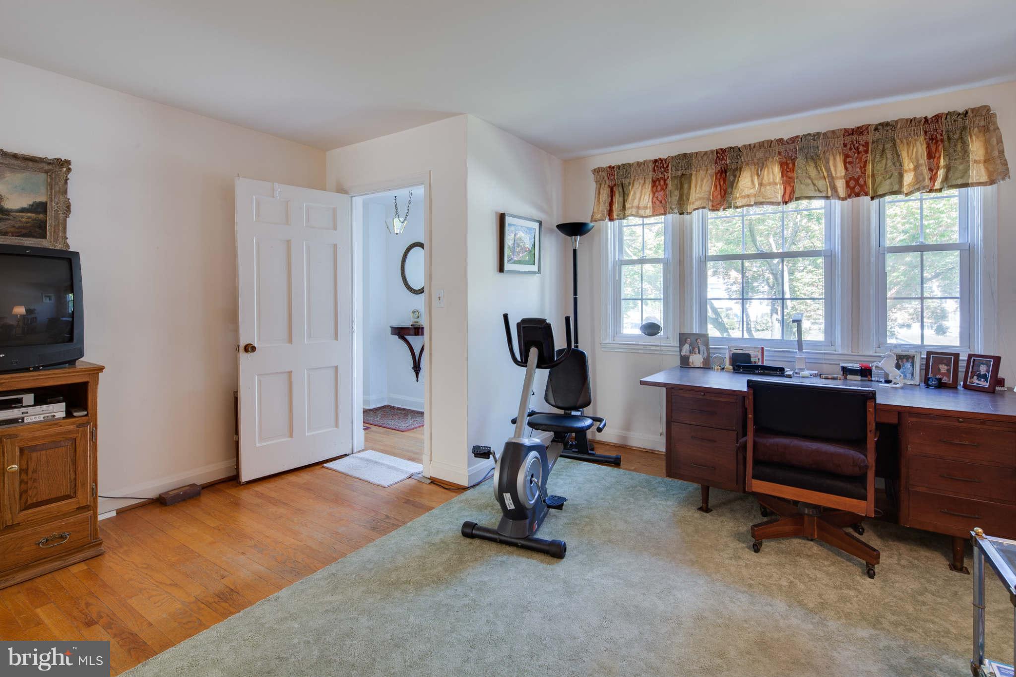 342 Greenlow Road Baltimore, MD 21228 - Photo 12 of 28 a view of a livingroom with workspace and a window